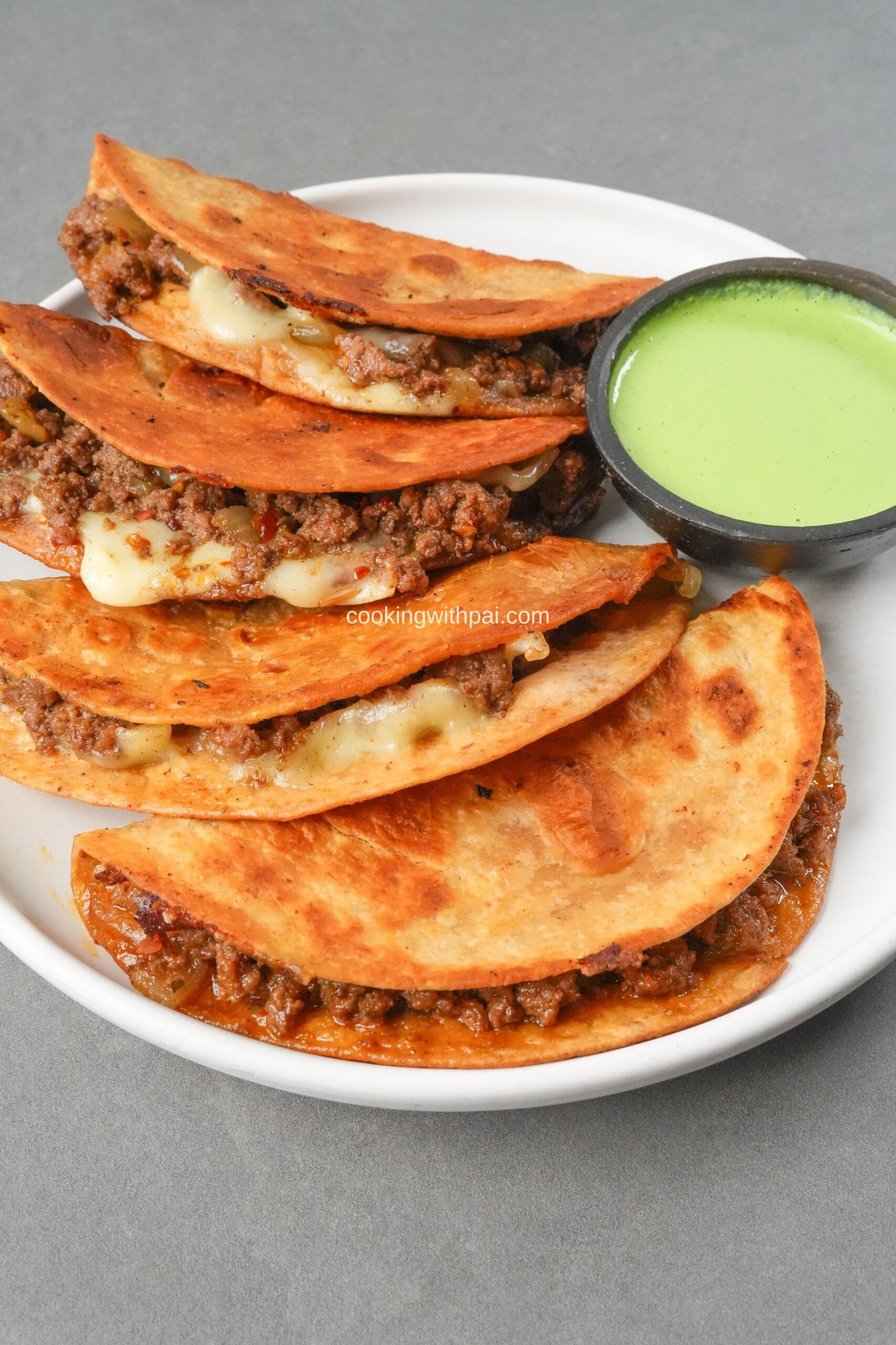 Cheesy Beef Tacos with Creamy Cilantro Sauce